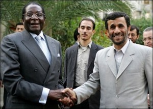 Mugabe and Ahmedinejad giving a handshake of evil